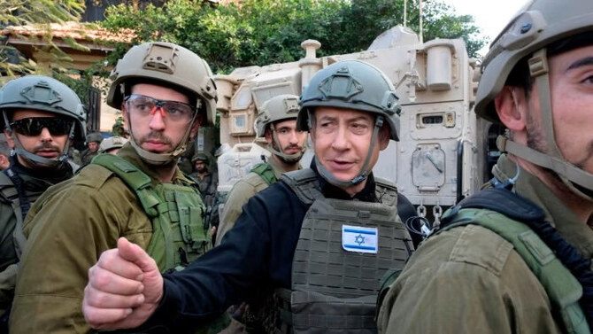 Benjamin Netanyahu, center, on a visit to the northern Gaza Strip. (AP/File)