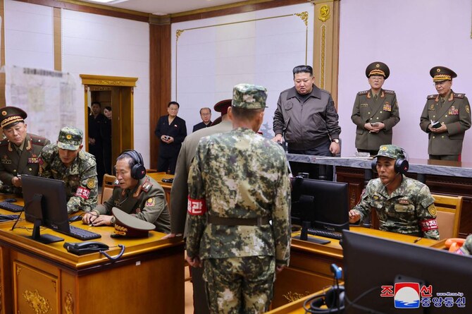 Kim Jong Un, center, visits the command of the 2nd Corps of the Korean People’s Army at an undisclosed location in North Korea. (KCNA/KNS via AFP)