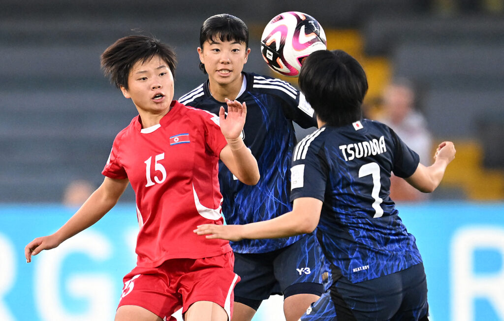 North Korea's forward Il Son Choe (L), Japan's defender Uno Shiragaki (C) and midfielder Fuka Tsunoda fight for the ball during the 2024 FIFA U-20 Women's World Cup final match between North Korea and Japan at the Nemesio Camacho 'El Campin' stadium in Bogota, on September 22, 2024. (AFP)