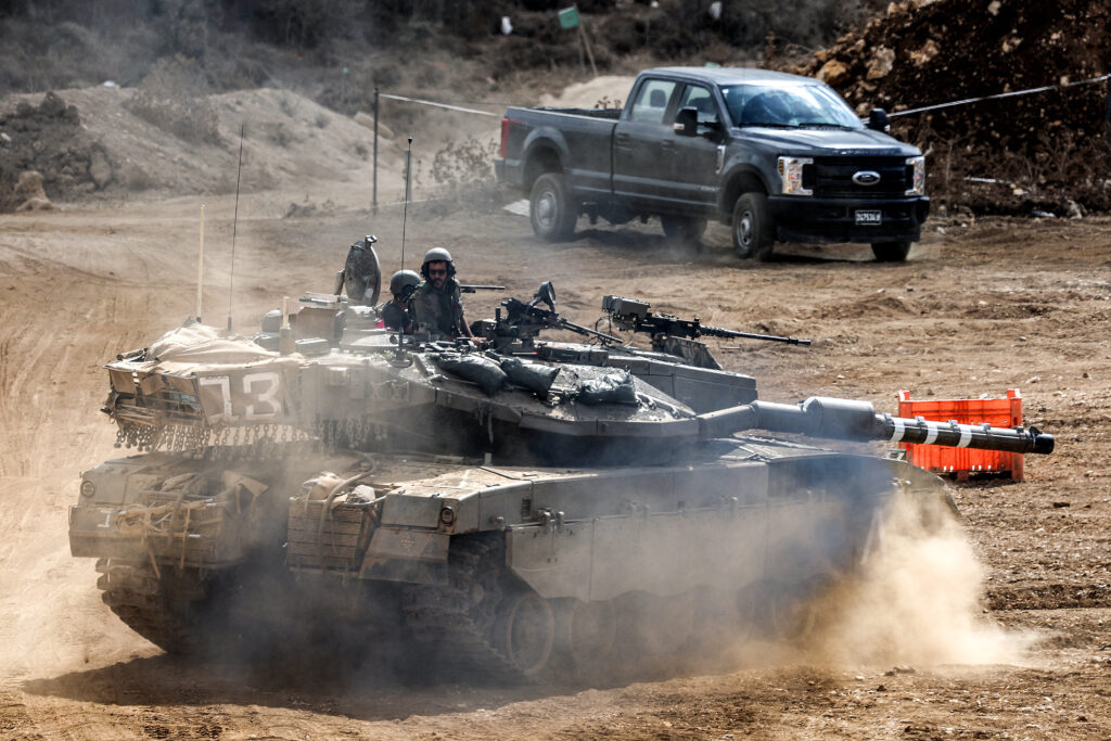 An Israeli army main battle tank moves at a position along the border with Lebanon in northern Israel on October 1, 2024. (AFP)
