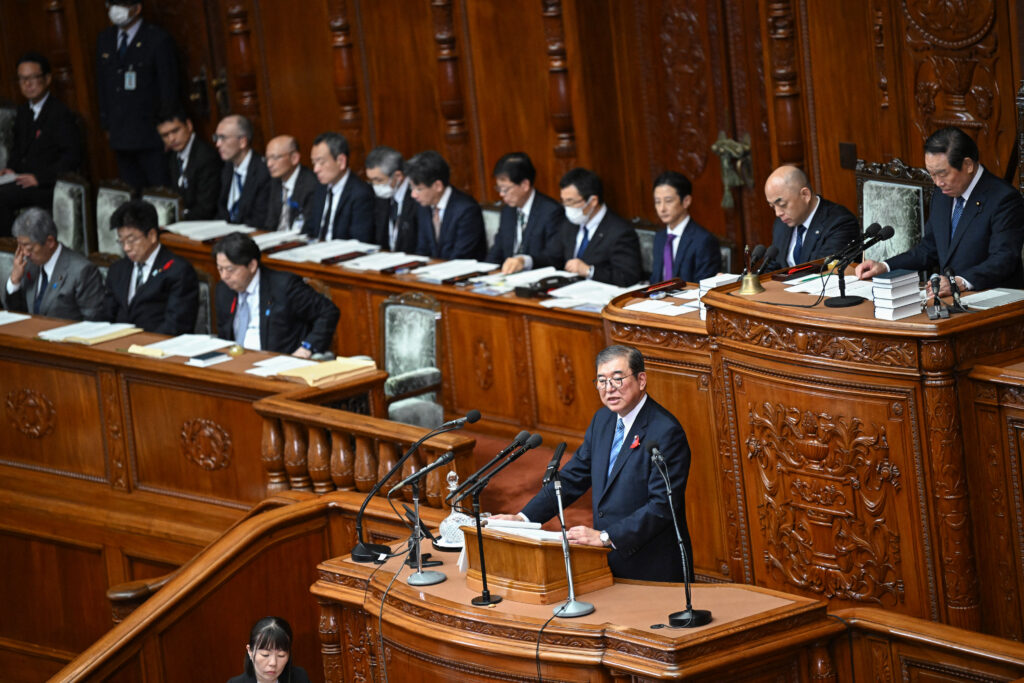 Ishiba and his Cabinet will stay in office until they win the election and are reappointed. (AFP)