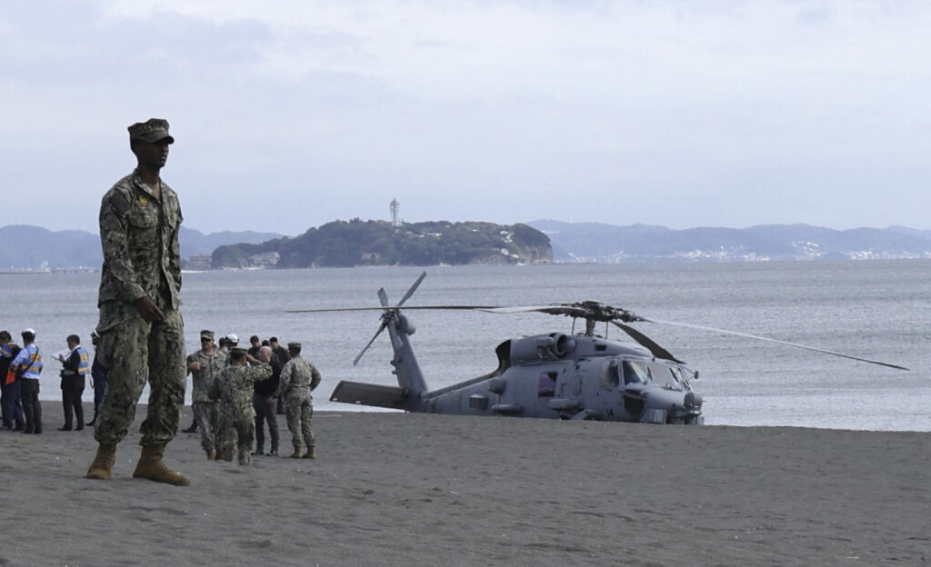 A US military helicopter is seen after landing on a beach in Chigasaki city of Kanagawa prefecture on October 10, 2024. (AFP)