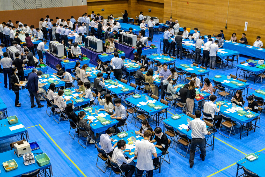 Officials of the election administration committee count ballots for Japan's general election in Tokyo on October 27, 2024. (AFP)