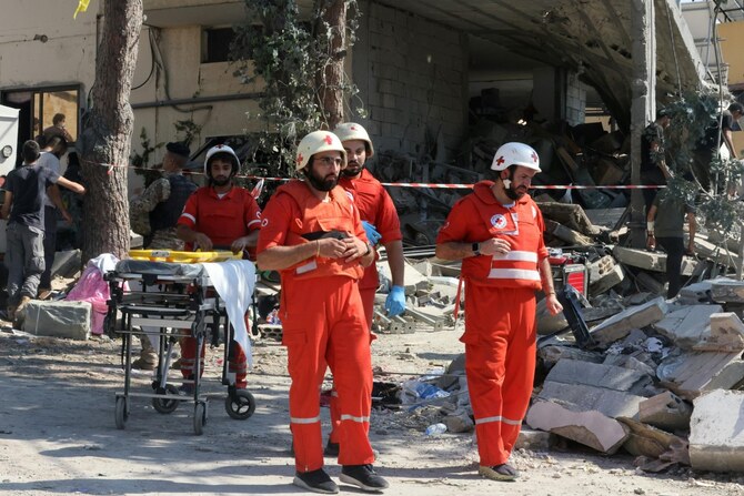 Paramedics arrive at the site of an Israeli strike on the Mount Lebanon village of Maaysra, east of the Christian coastal town of Byblos, on September 25, 2024 (AFP)