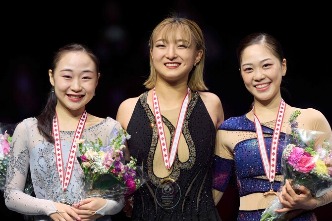 Gold medalist Kaori Sakamoto of Japan (C) with compatriots silver medalist Rino Matsuike (L) and bronze medalist Hana Yoshida during the victory ceremony in the women's competition at the 2024 Skate Canada International at Scotiabank Center in Halifax, Nova Scotia. (AFP)