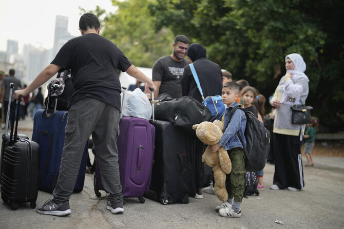 People, mostly Turkish citizens, wait to go on board of a Turkish military ship evacuating them from Lebanon to Turkiye, in Beirut port, on Oct. 10, 2024. (AP)