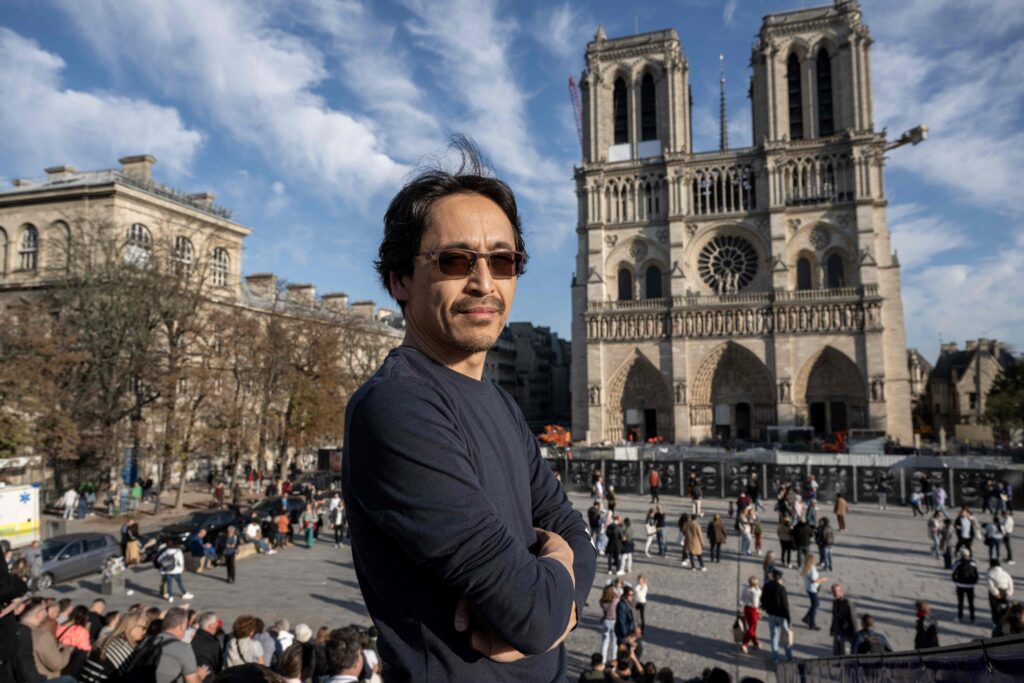 Japanese organ builder Itaru Sekiguchi, currently working on the harmonisation of the Cathedral organ, poses during a photo session in front the Notre-Dame de Paris Cathedral in Paris, on October 24, 2024. At the age of 10, an “infernal noise” changed Itaru Sekiguchi's life. The great organ of Notre-Dame de Paris had just resounded in front of him and, forty years later, occupies the days and nights of this Japanese lover of French culture. (AFP)