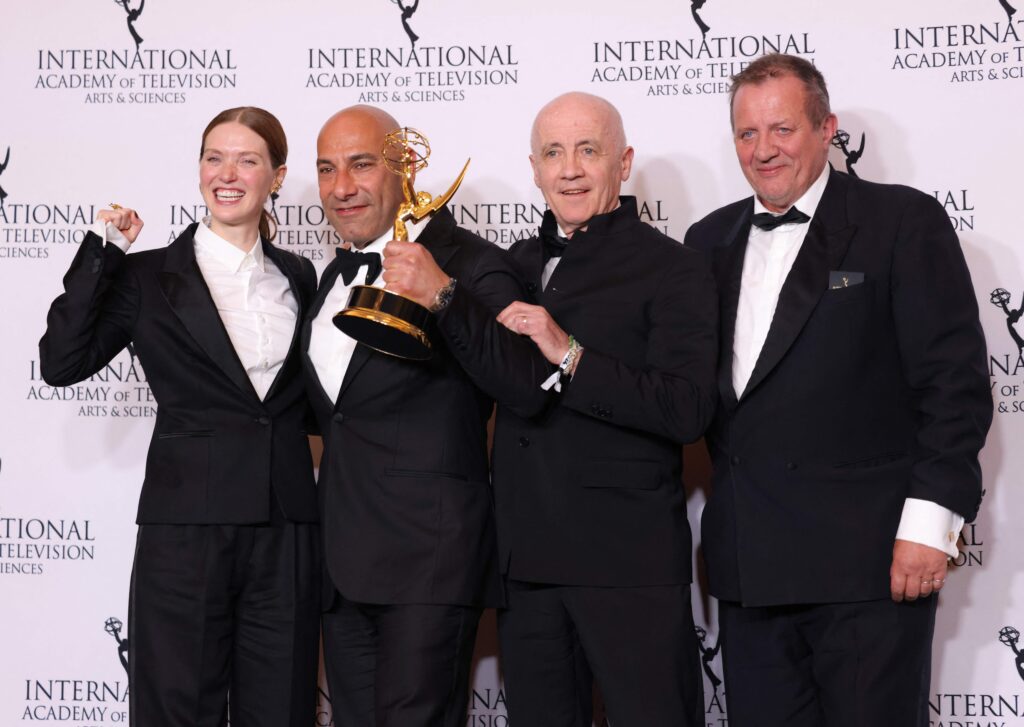 French actress Fleur Geffrier (L), producer Sam Kozhaya (2L), director Alfred Lot (R) pose with the Drama Series award for
