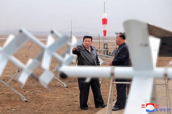 North Korean leader Kim Jong Un inspects the performance test of suicide attack drones at an undisclosed location in North Korea in this picture released on Nov. 15, 2024. (KCNA via KNS/AFP)