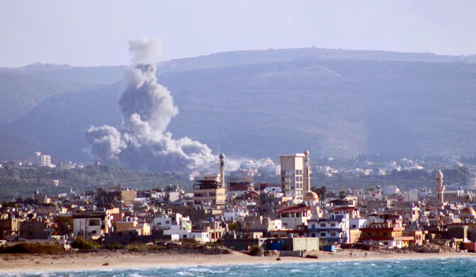 Smoke rises from the site of an Israeli airstrike that targeted the village of Qlayleh on Sunday. (AFP)