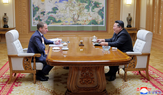 North Korea's leader Kim Jong Un (R) meeting with Russia's Minister of Natural Resources and Ecology Alexander Kozlov at the headquarters of the Central Committee of the Communist Party in Pyongyang. (AFP)