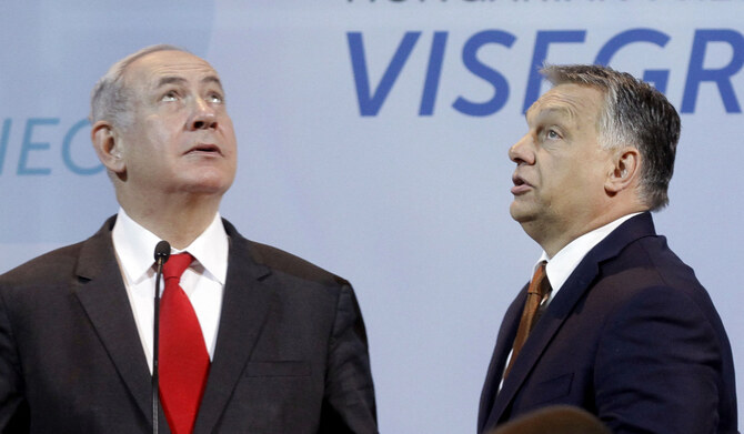 In this file photo taken on July 19, 2017 Israeli Prime Minister Benjamin Netanyahu (L) and Hungarian Prime Minister Viktor Orban (R) look around in the main hall of Pesti Vigado Cultural Center prior to a joint press conference with V4 - Visegrad countries Prime Ministers in Budapest, Hungary. (AFP)