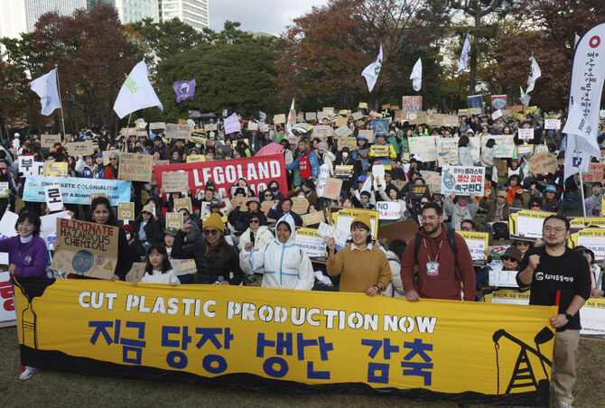 Environment activists stage a rally in in Busan, South Korea, on Nov. 23, 2024, calling for a strong global plastics treaty ahead of the fifth