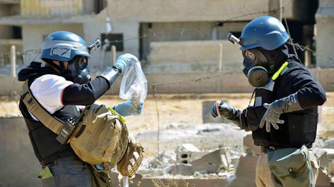 Illustrative image of members of a UN investigative team taking samples near the site of an alleged chemical weapons attack, in Syria. (AP/File)
