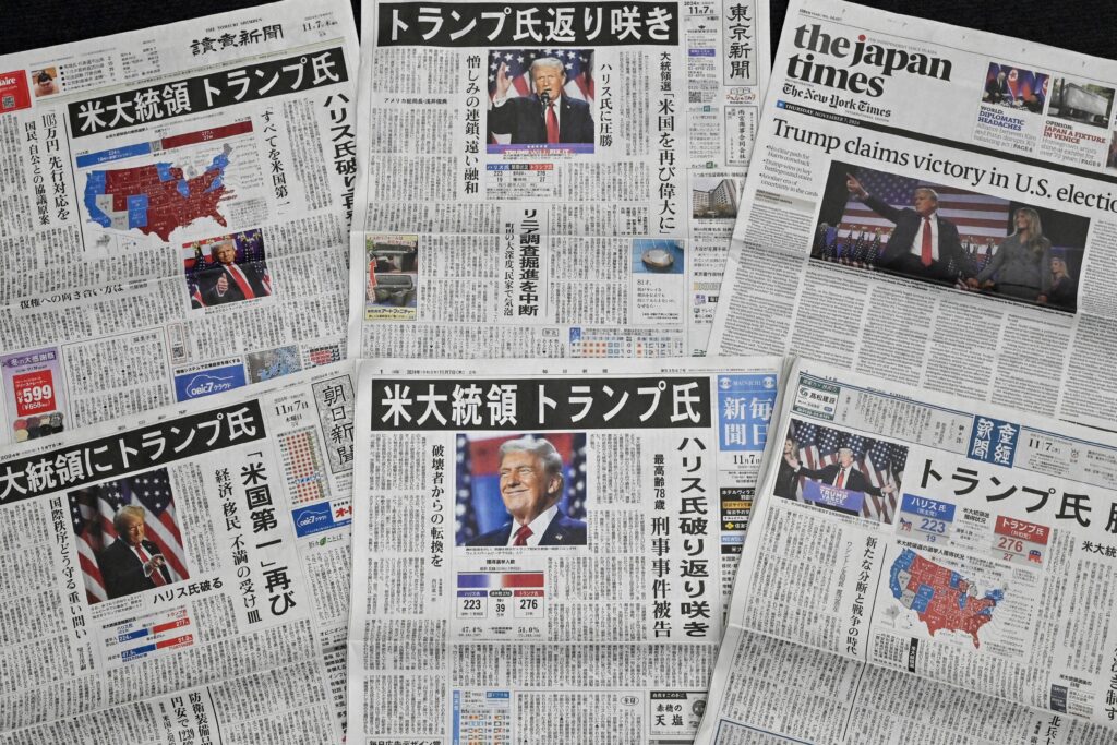 This photo illustration shows a selection of newspaper front pages in Tokyo on November 7, 2024, with images of US president-elect Donald Trump the day after his election victory over US Vice President Kamala Harris. (AFP)