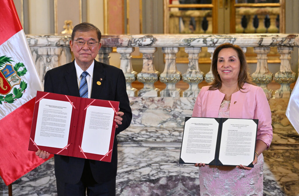 Japan's Prime Minister ISHIBA Shigeru and Peru's President Dina Boluarte hold a joint statement after a bilateral meeting at the government palace in Lima on November 17, 2024. (AFP)