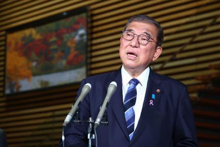 Japan's Prime Minister Shigeru Ishiba speaks to the media after the cabinet approved a comprehensive economic stimulus package, at the prime minister's office in Tokyo on November 22, 2024. (AFP)
