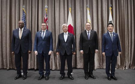 In this photo provided by South Korea Defense Ministry (From left): Lloyd Austin, Pat Conroy, Nakatani Gen, Gilberto C. Teodoro Jr., and Kim Yong Hyun pose during the ASEAN defense ministers' meeting in Vientiane, Laos, Thursday, Nov. 21, 2024. (South Korea Defense Ministry via AP).
