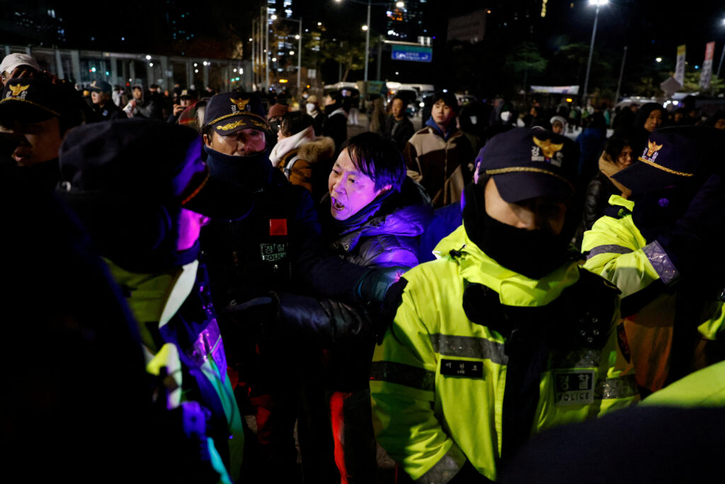 A man confronts police officers outside the National Assembly, after South Korean President Yoon Suk Yeol declared martial law, in Seoul, South Korea, December 4, 2024. (REUTERS/Kim Soo-hyeon)