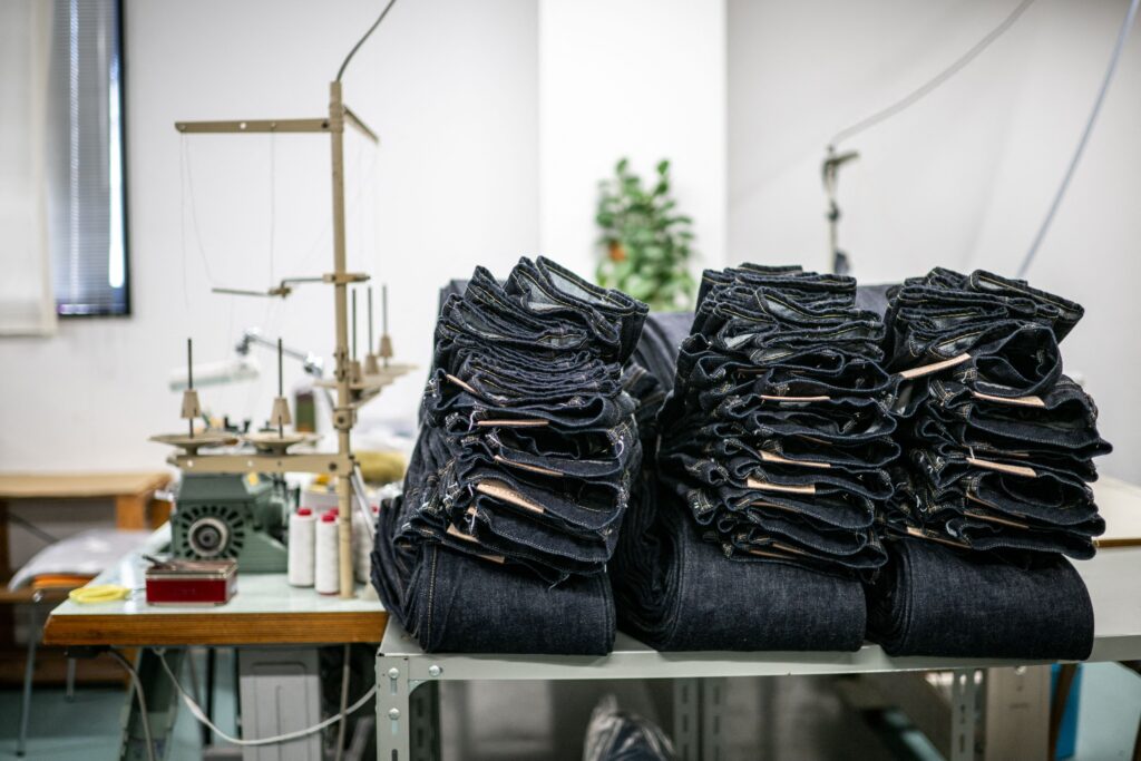 This picture taken on September 4, 2024 shows jeans at the Momotaro Jeans factory in the Kojima district of Okayama. Call it an antidote to fast fashion: Japanese jeans hand-dyed with natural indigo and weaved on a clackety vintage loom, then sold at a premium to global denim connoisseurs. (AFP)