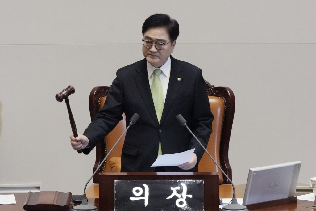 South Korea's National Assembly Speaker Woo Won Shik bangs a gavel during a plenary session for the impeachment motion against South Korean acting President Han Duck-soo at the National Assembly in Seoul, South Korea, Friday Dec. 27, 2024. (AP Photo/Ahn Young-joon)