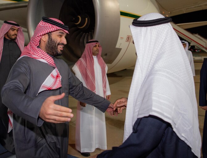 Saudi Arabia’s Crown Prince Mohammed bin Salman is greeted by UAE president Sheikh Mohamed bin Zayed on arrival in the country. (SPA)