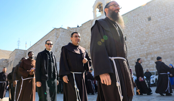 Clergy members walk outside the Church of the Nativity, on the day of the ceremony to launch the beginning of Advent leading to Christmas, in Bethlehem in the Israeli-occupied West Bank November 30, 2024. (REUTERS)