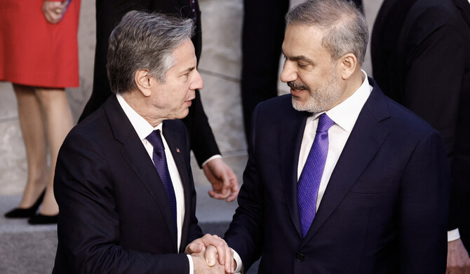 US Secretary of State Antony Blinken (L) shakes hands with Turkish Foreign Minister Hakan Fidan (R) after an official photo during the North Atlantic Council (NAC) Ministers of Foreign Affairs meeting at the NATO headquarters in Brussels on April 3, 2024. (AFP)
