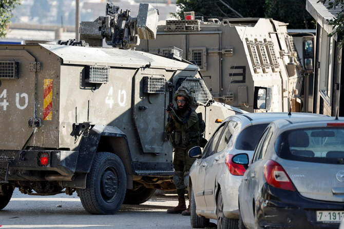 An Israeli soldier holds a rifle near a hospital in Tubas, in the Israeli-occupied West Bank, Dec. 3, 2024. (Reuters)