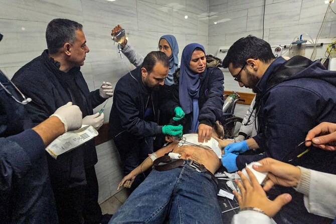A victim is treated inside the Kamal Adwan hospital in Beit Lahya in the northern Gaza Strip, following a reported Israeli strike that hit the medical complex on December 6, 2024, as the war between Israel and the Palestinian Hamas militant group continues. (AFP)