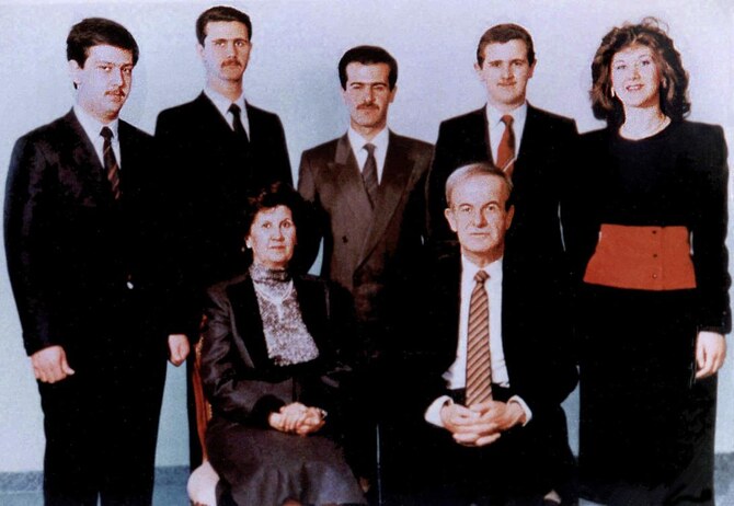 (FILES) — A family picture dated 1985 shows Syria’s late president Hafez Assad and his wife Anissah Makhlouf (seated) and, behind them, from R to L their five children: Bushra, the late Majd, the late Bassel (1962-94), deposted president Bashar, and the youngest son, Maher. A Syria war monitor said that Assad has left the country, after losing swathes of territory to a lightning offensive led by an Islamist-led rebel coalition that said it entered Damascus on December 8, 2024. (AFP)
