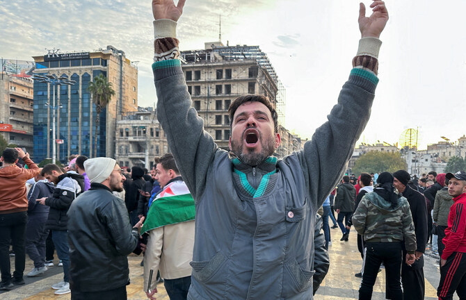 People gather at Saadallah Al-Jabiri Square in Aleppo to celebrate the end of Bashar Assad’s 24-year rule on Dec. 8, 2024. (Reuters)