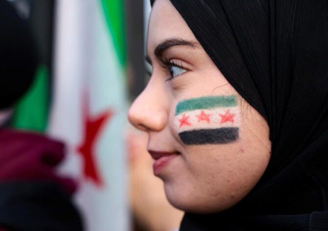 A woman looks on, as Syrian-Americans and supporters celebrate after Syrian rebels announced that they had ousted Syrian President Bashar al- Assad in Syria, in Dearborn, Michigan, U.S. December 8, 2024. (REUTERS)
