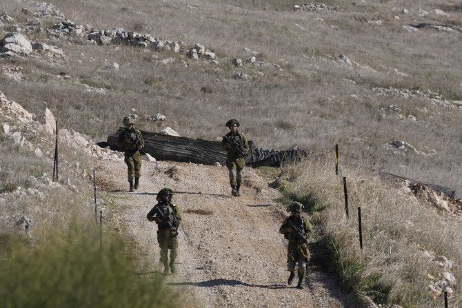 Israeli soldiers patrol near the so-called Alpha Line that separates the Israeli-annexed Golan Heights from Syria, in the town of Majdal Shams, Monday, Dec. 9, 2024. (AP)