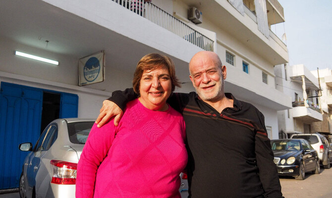 Suhail Al-Hamwi (61) poses for a picture with his wife Josephine in the coastal town of Chekka in northern Lebanon on December 9, 2024, after spending 33 years in a Syrian prison, following the ousting of Syria's President Bashar Al-Bashar a day earlier. (AFP)