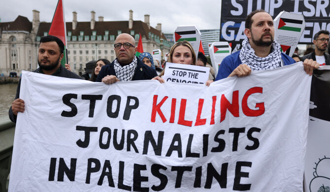 Demonstrators cross the Westminster Bridge as people participate in a silent procession during a vigil for Gaza, amid the ongoing conflict between Israel and the Palestinian Islamist group Hamas, in London, Britain February 10, 2024. (REUTERS)