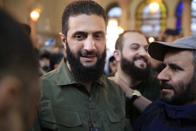 Abu Mohammed al-Jolani (C), before his address at the capital's landmark Umayyad Mosque on December 8, 2024. (File/AFP)