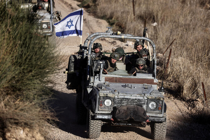 Israeli military vehicles ride through Syria close to the ceasefire line between the Israeli-occupied Golan Heights and Syria on December 15, 2024. (Reuters)