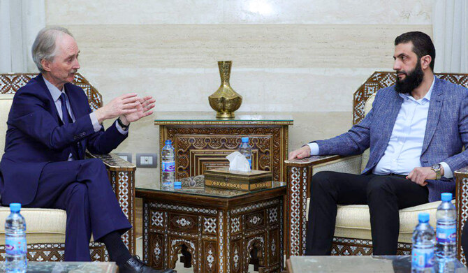 This handout photo provided by Syria's Interim Government shows UN Special Envoy Geir Pedersen meeting with Hayat Tahrir al-Sham (HTS) leader Abu Mohammed al-Jolani, now using his real name Ahmed al-Sharaa in Damascus on December 15, 2024. (AFP)
