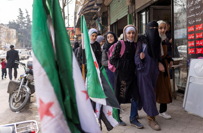 School children walk through a street in Idlib, a northwestern Syrian city where Hayat Tahrir al-Sham (HTS) had maintained an administration at the time when Syria's civil war front lines were frozen, Syria, December 16, 2024. (Reuters)