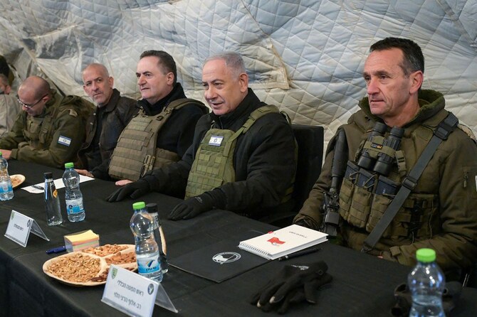 Israeli PM Benjamin Netanyahu and Defence Minister Israel Katz (C-L), sit between army Chief-of-Staff Herzi Halevi (R) and Israel’s Chief of Mossad David Barnea (2nd L), at Mount Hermon in the annexed Golan Heights, on December 17, 2024. (AFP)
