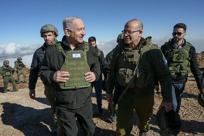 Israeli Prime Minister Benjamin Netanyahu visited Israeli forces at Mount Hermon 10km inside the buffer zone from the occupied Golan Heights. (GPO/AFP)