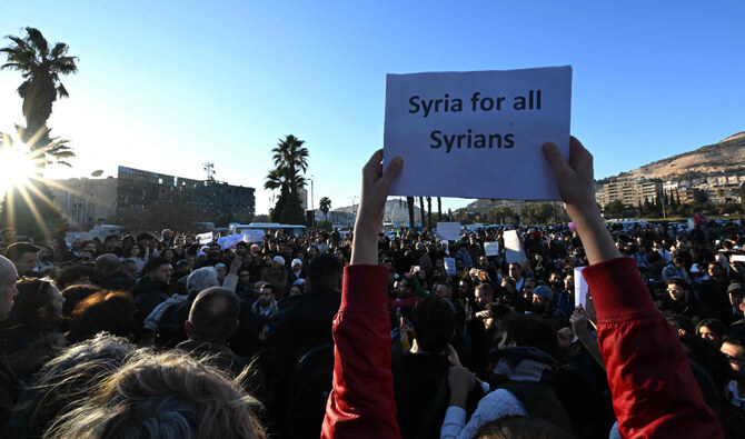 Syrian attend a gathering to call for democracy and women's rights in Damascus' Umayyad Square on December 19, 2024. (AFP)