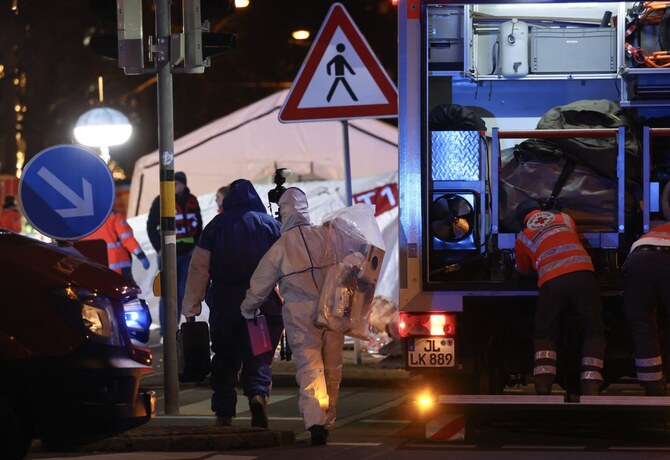 Police investigation teams arrive in the area where a car crashed into a crowd at a Christmas market injuring more than 60 people on December 20, 2024 in Magdeburg, eastern Germany (AFP)