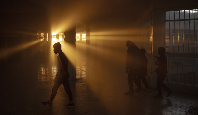 The setting sun casts a warm glow through the windows of the infamous Saydnaya military prison in the outskirts of Damascus, Syria, Wednesday, Dec. 18, 2024. (AP)