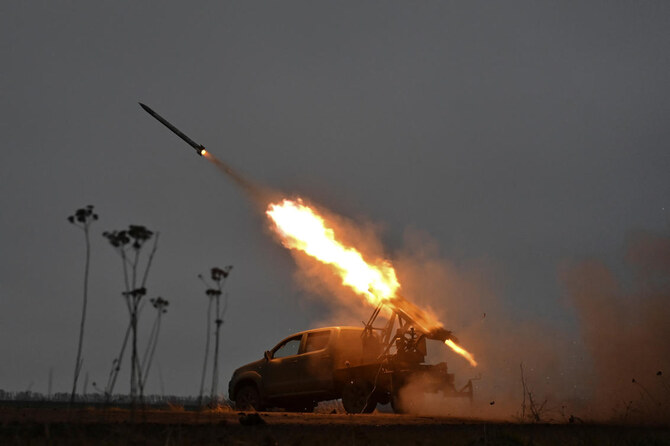 Members of the artillery unit of the special rifle battalion of Zaporizhzhia region police fire a small multiple launch rocket system (MLRS) towards Russian troops in a front line, amid Russia's attack on Ukraine, in Zaporizhzhia region, Ukraine. (File/Reuters)