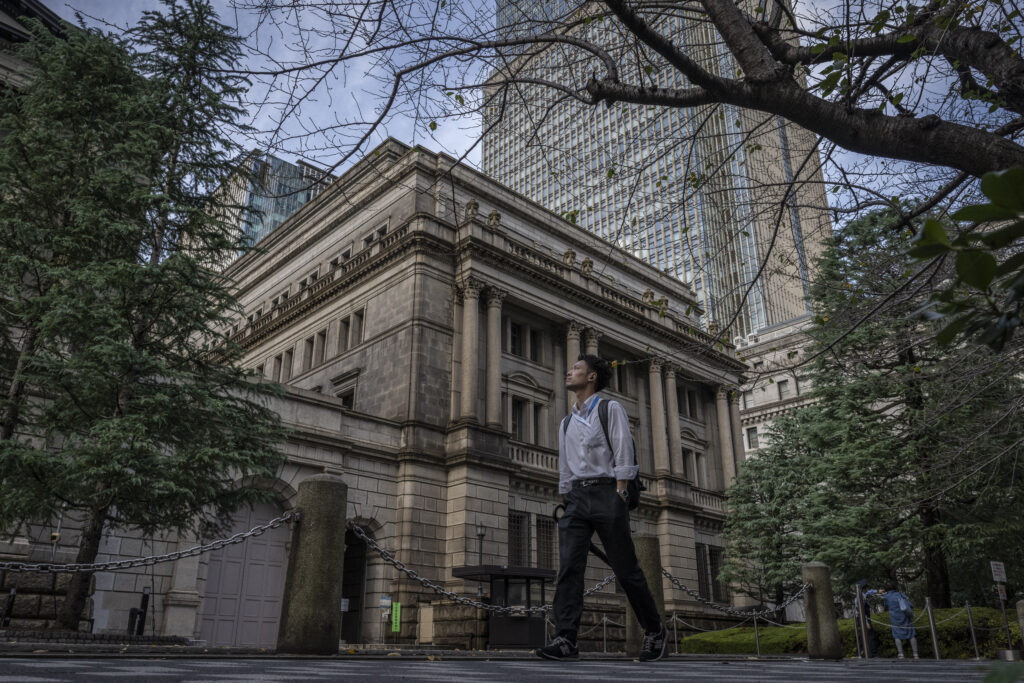 The BOJ's monetary easing campaign sent its holdings of Japanese government bonds swelling to 569 trillion yen as of the end of September this year, more than 50 percent of their outstanding amount. (AFP)