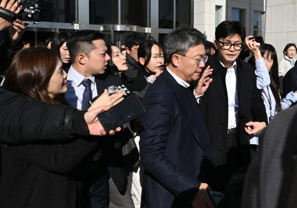 South Korea's ruling People Power Party leader Han Dong-hoon (C) is surrounded by reporters as he leaves the National Assembly in Seoul on December 6, 2024. (AFP)