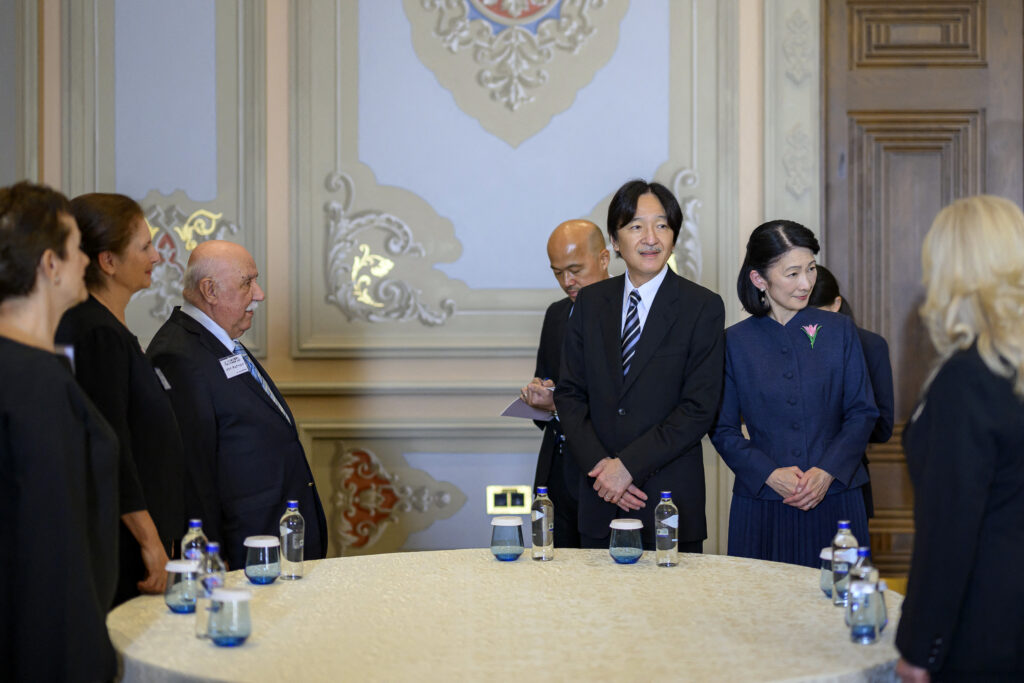 Japan's Crown Prince Akishino and his wife Japan's Crown Princess Kiko are welcomed by Turkish nationals related with Japan during their visit at the Ciragan palace in Istanbul. (AFP)