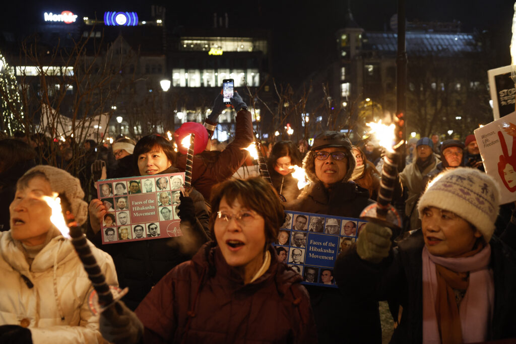 The crowd cheered and applauded, repeating, 